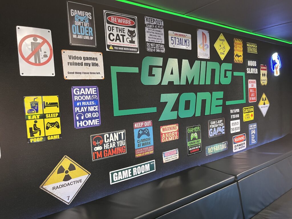 Our Truck: 1-Up Game Truck Gaming Zone wall with video game decor